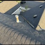 Completed new roof showing new architectural shingles, roof vents, and pipe flashing, Bend, Oregon