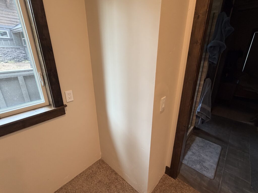 Completed primary bedroom closet remodel with fresh drywall and paint, Sunriver, Oregon