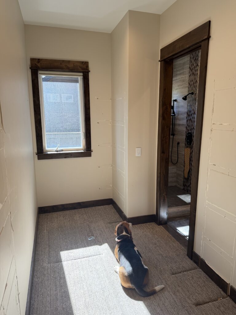Wide view of primary bedroom and closet doorway before drywall repair, Sunriver, Oregon