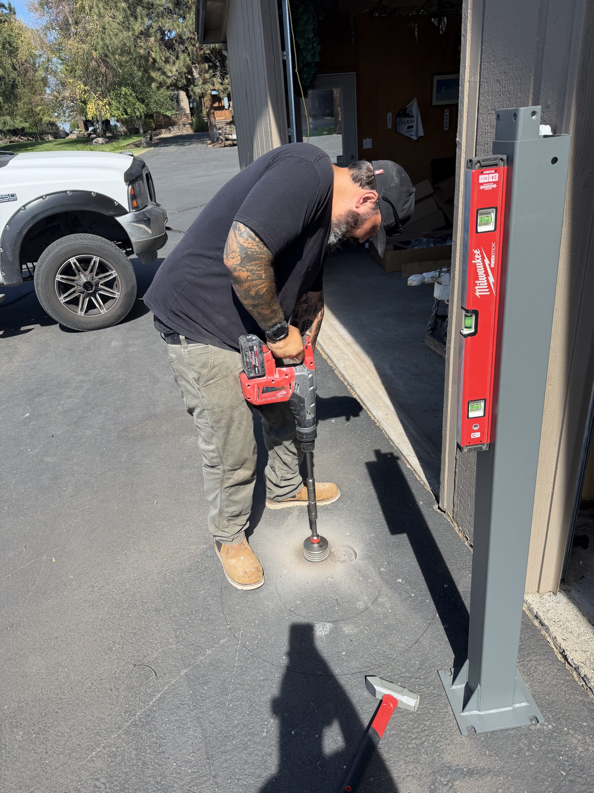 Justin performing exterior installation work on a Central Oregon project for PNW Residential and Commercial.