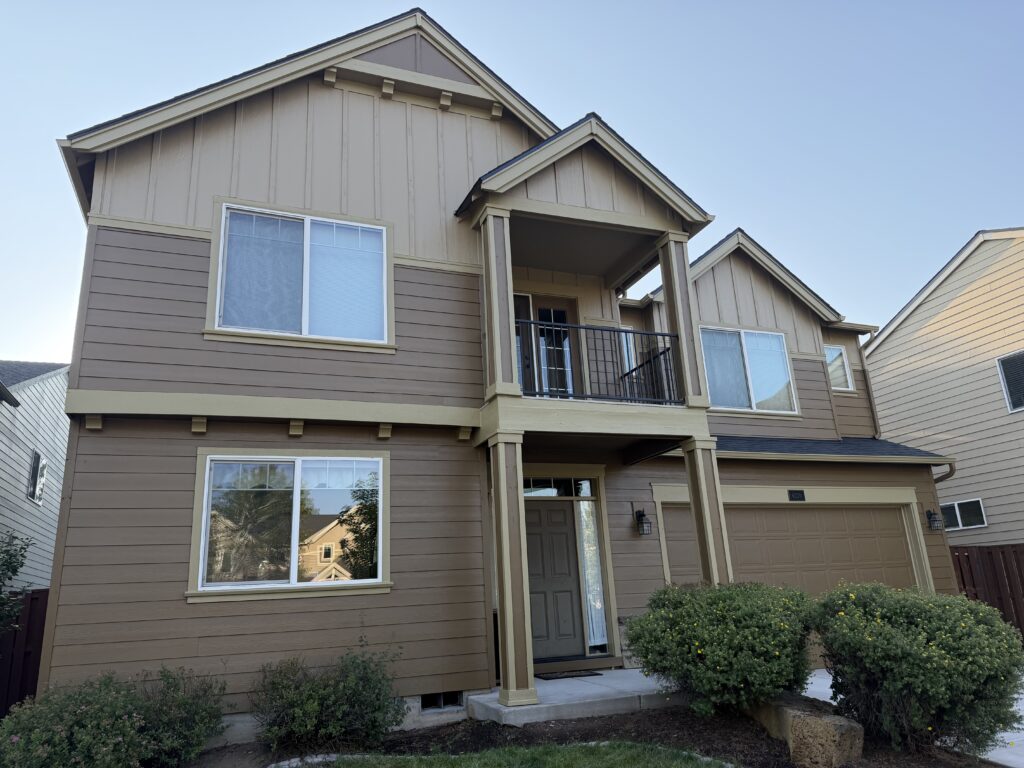Completed exterior house painting showing full front elevation in Bend, Oregon